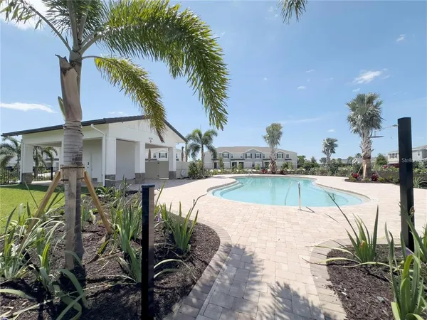 a view of a swimming pool with a patio
