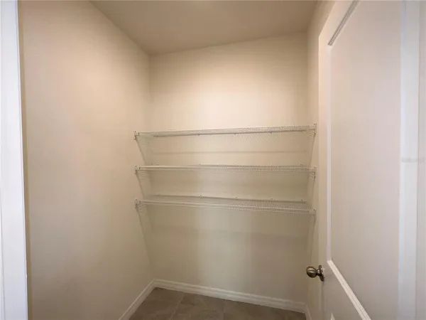 a empty closet with white paint