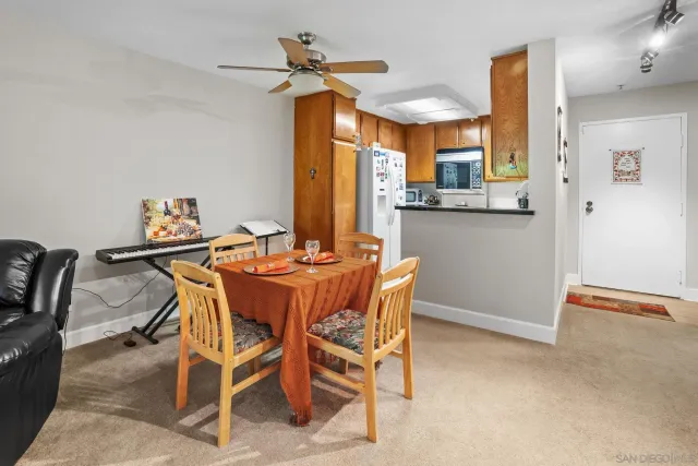 a dining room with furniture and window