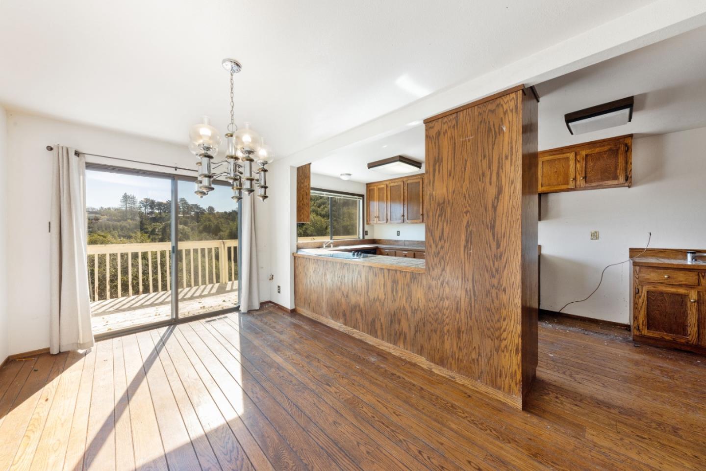 20 Pine Court Hillsborough, CA 94010 - Photo 5 of 14 a view of a hallway with wooden floor and a kitchen