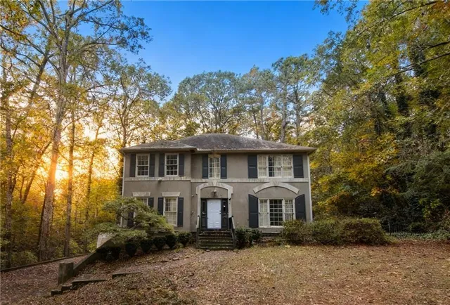 a front view of a house with garden