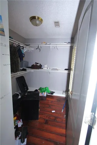 a close up of a vase of flowers sitting on a table