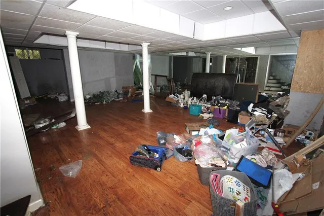 a room with water heater and wooden floor