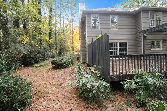 a backyard of a house with lots of green space