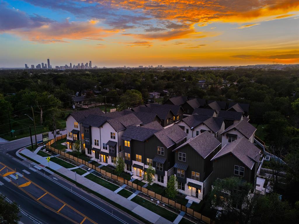 3500 Pecan Springs Road, Unit 9 Austin, TX 78723 - Photo 2 of 40 Aerial view at dusk of a view of skyline