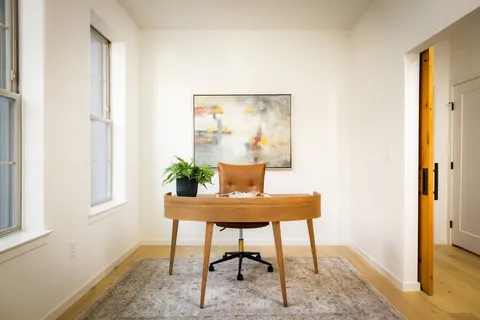 a view of a workspace with furniture