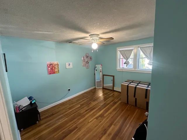 a room with furniture and wooden floor