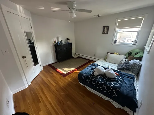 a living room with rug floor and a rug