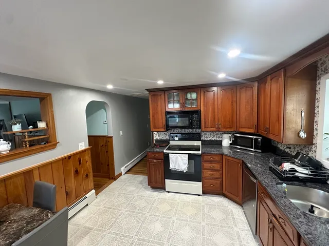 a large kitchen with stainless steel appliances