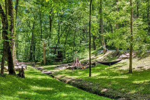 a backyard of a house with table and chairs