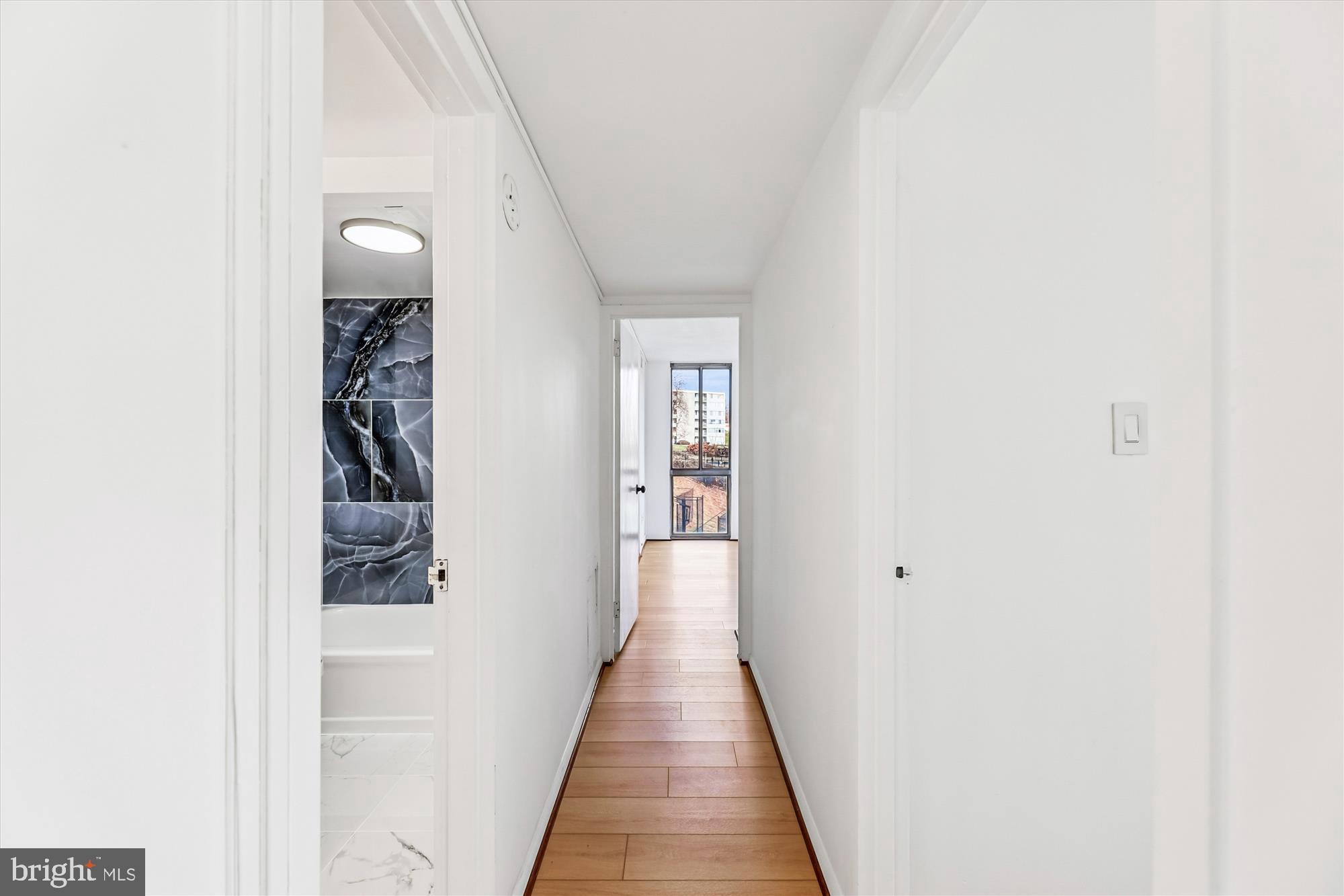 1836 Metzerott Road, Unit T3 Hyattsville, MD 20783 - Photo 15 of 28 a view of a hallway with wooden floor and staircase