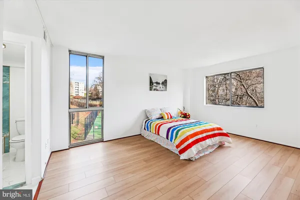 a room with wooden floor and shoes