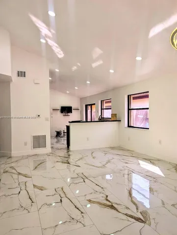 a view of a kitchen with kitchen and a window