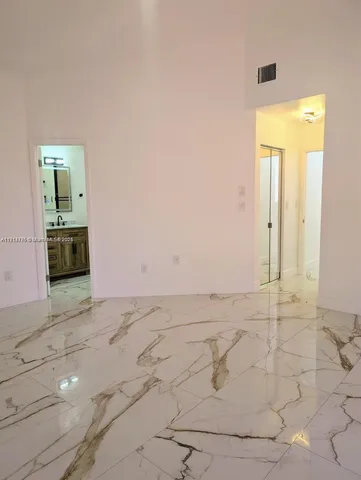 an empty room with mirror