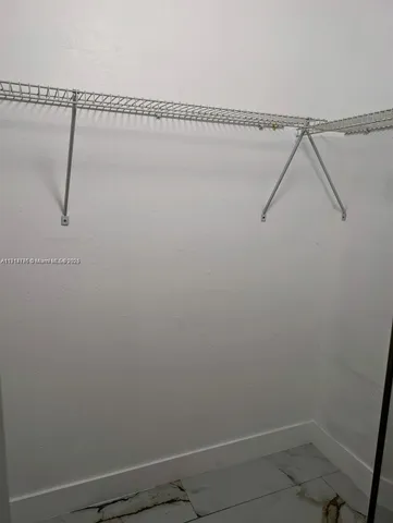 a view of small space with racks on the wall