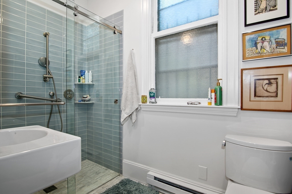36 Alveston Street Boston, MA 02130 - Photo 13 of 38 a bathroom with a sink toilet and shower