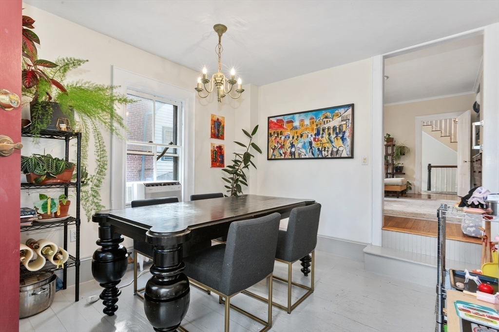 36 Alveston Street Boston, MA 02130 - Photo 20 of 38 a view of a dining room with furniture and chandelier