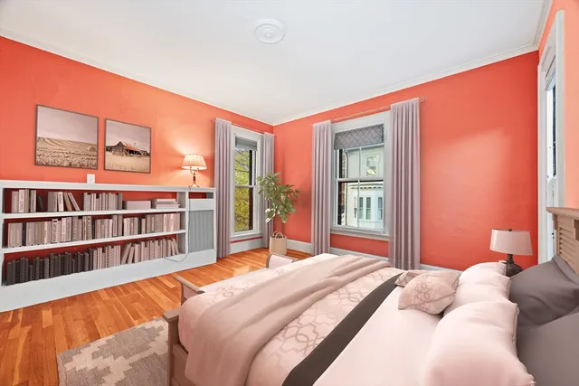 a bed room with a bed and a book shelf