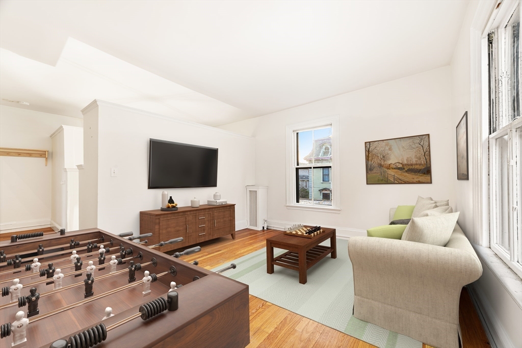 36 Alveston Street Boston, MA 02130 - Photo 26 of 38 a living room with furniture and a flat screen tv