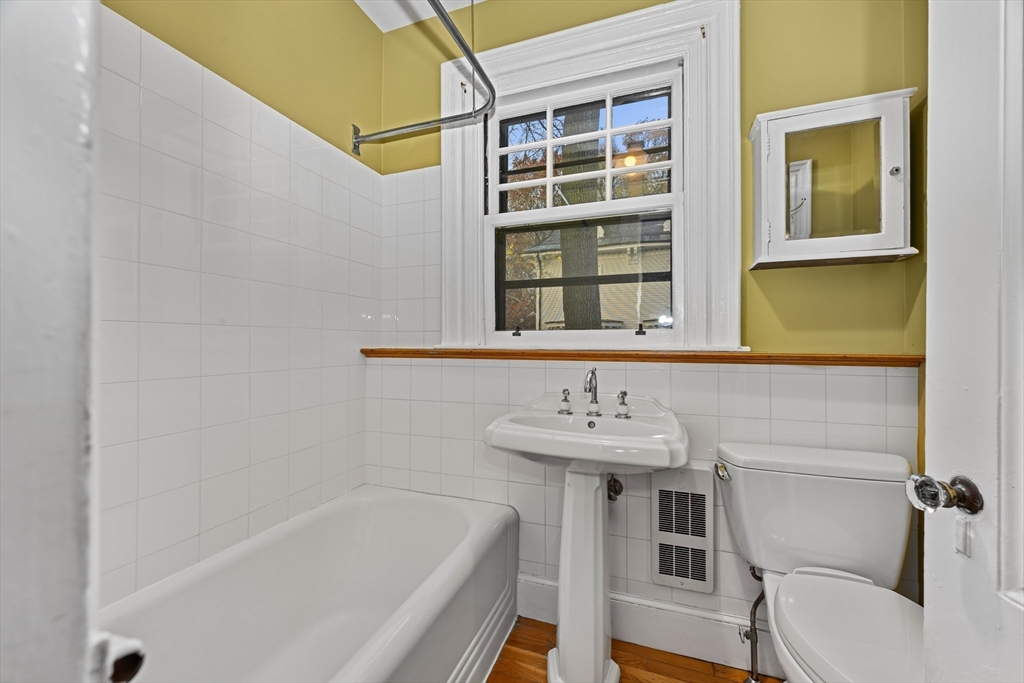 36 Alveston Street Boston, MA 02130 - Photo 27 of 38 a bathroom with a sink and a toilet