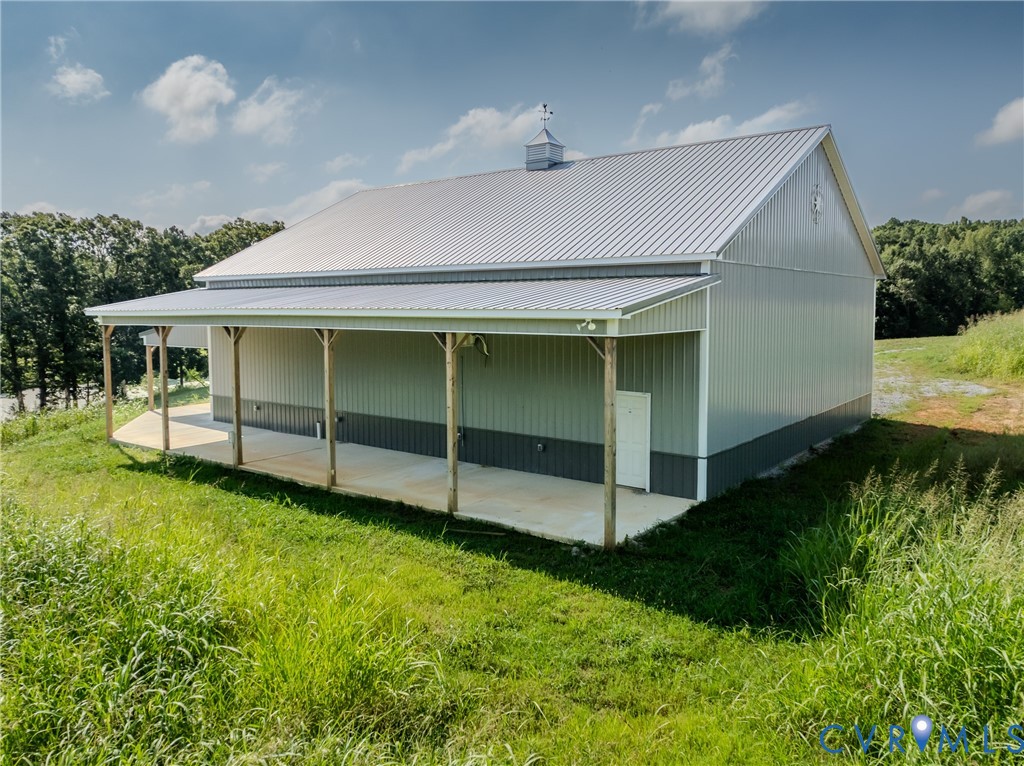 6721 Amelia Springs Road Jetersville, VA 23083 - Photo 9 of 16 a view of a backyard with plants and large trees