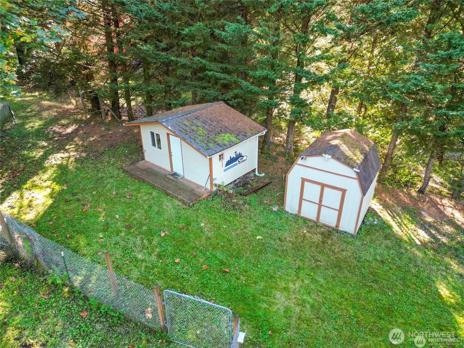 14310 200th Avenue Southeast Renton, WA 98058 - Photo 6 of 39 an aerial view of a house with yard and large trees