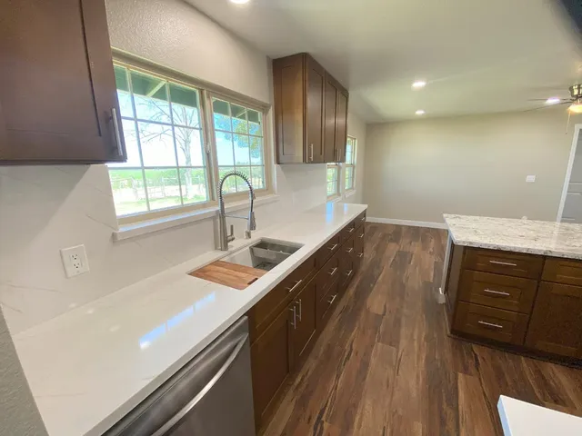 a view of kitchen with cabinets