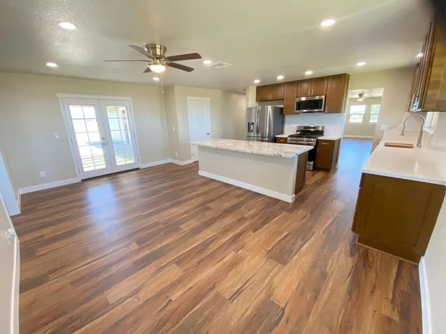 a view of kitchen with sink and microwave