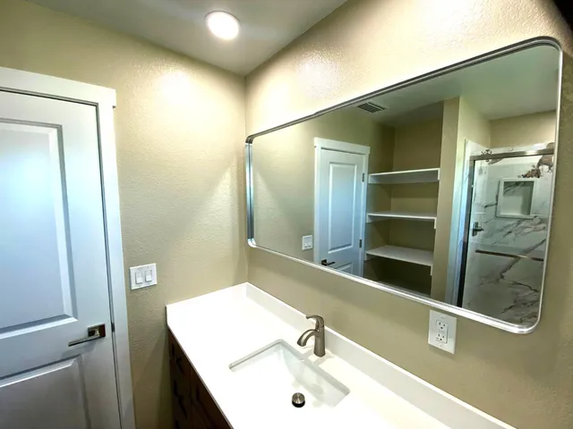 a view of an empty room and window