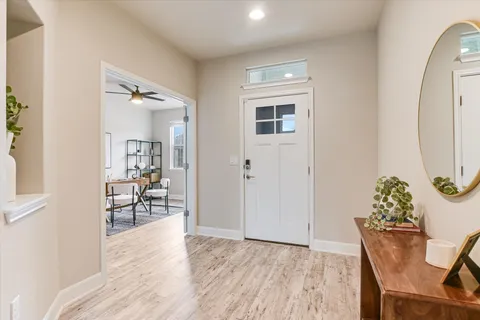 a view of a livingroom with furniture and wooden floor