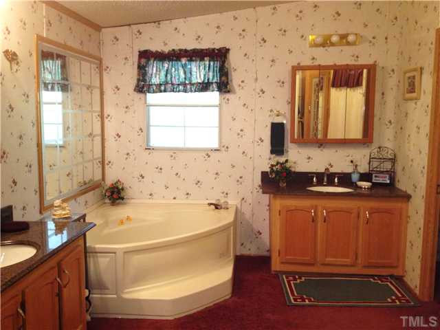 400 Red House Road Smithfield, NC 27577 - Photo 15 of 16 GARDEN TUB/SEP SHOWER-DBL VANITY W/GRANITE COUNTER TOPS!! SELLER INSTALLING NEW VINYL FLOORING!! Master Bath/Spa