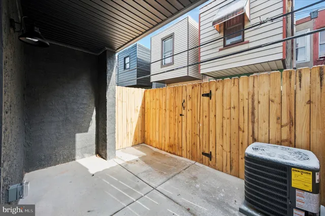 a front view of a building with car parked