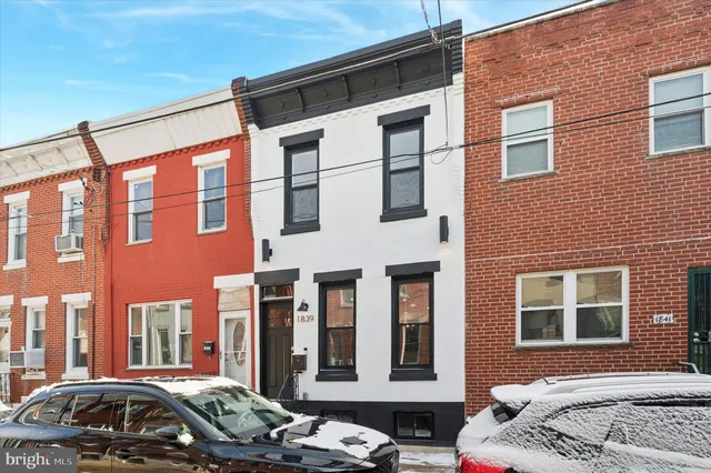 a view of an empty room with stairs