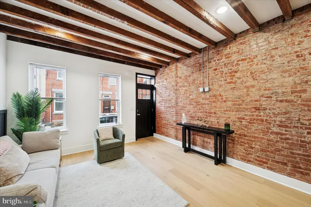 a kitchen with stainless steel appliances a refrigerator sink and stove