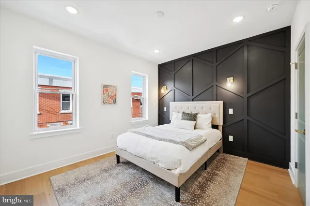 a bathroom with a sink vanity and a mirror