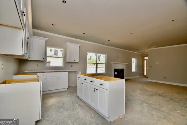 a view of a kitchen with furniture and window