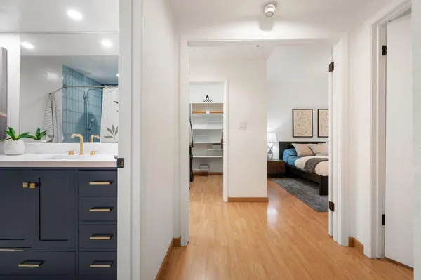 a en suite bathroom with a sink and a mirror