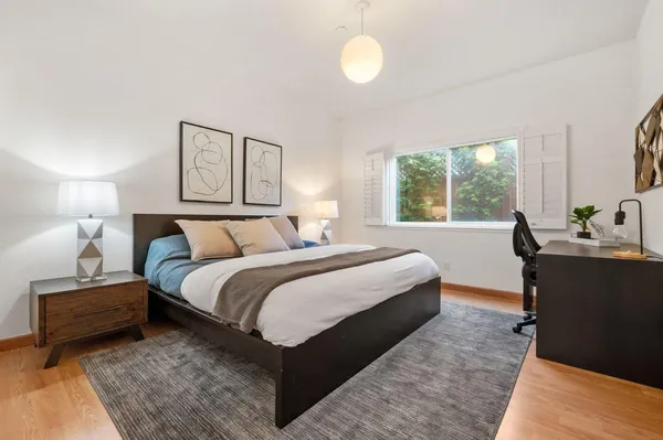 a bedroom with bed and window