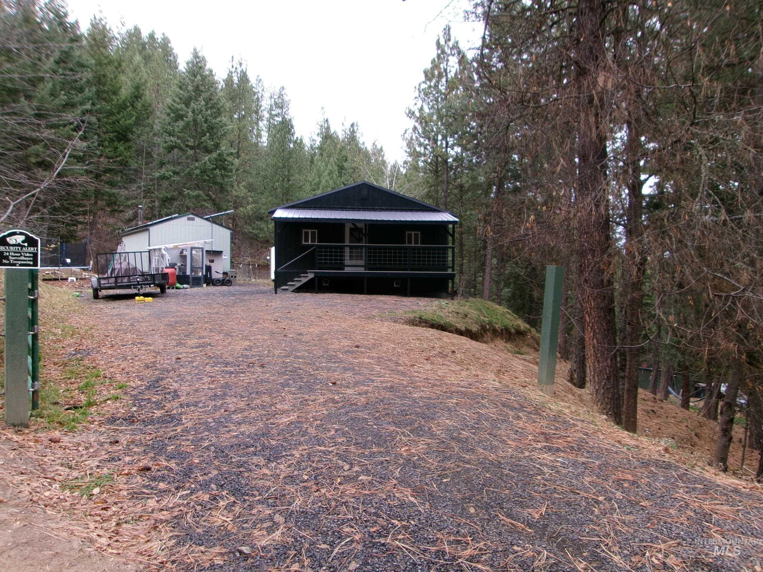 123 Conifer Lane Stites, ID 83552 - Photo 2 of 48 View of front of property featuring a metal roof and a wooden deck