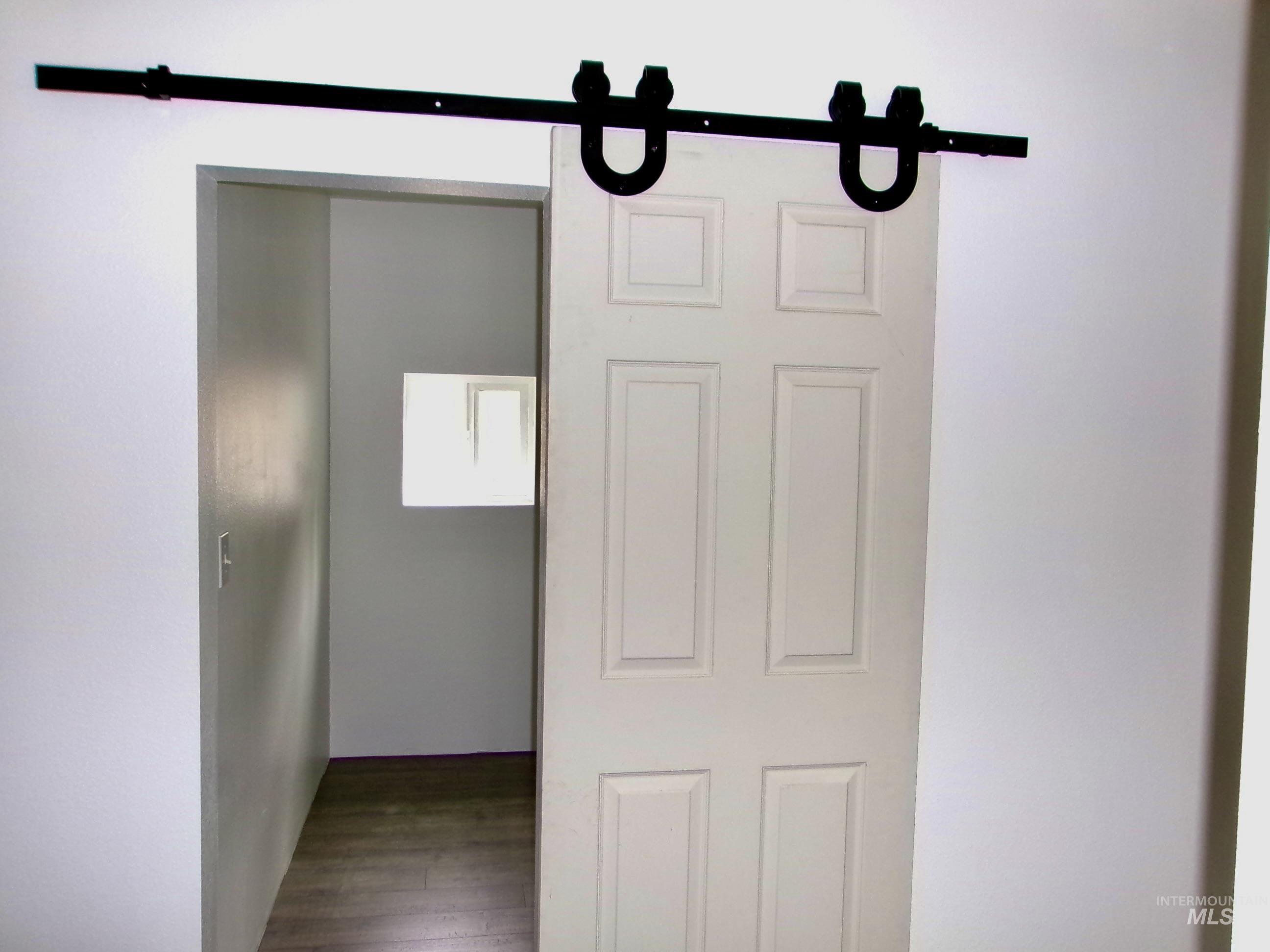 123 Conifer Lane Stites, ID 83552 - Photo 21 of 48 Detailed view of wood finished floors and a barn door