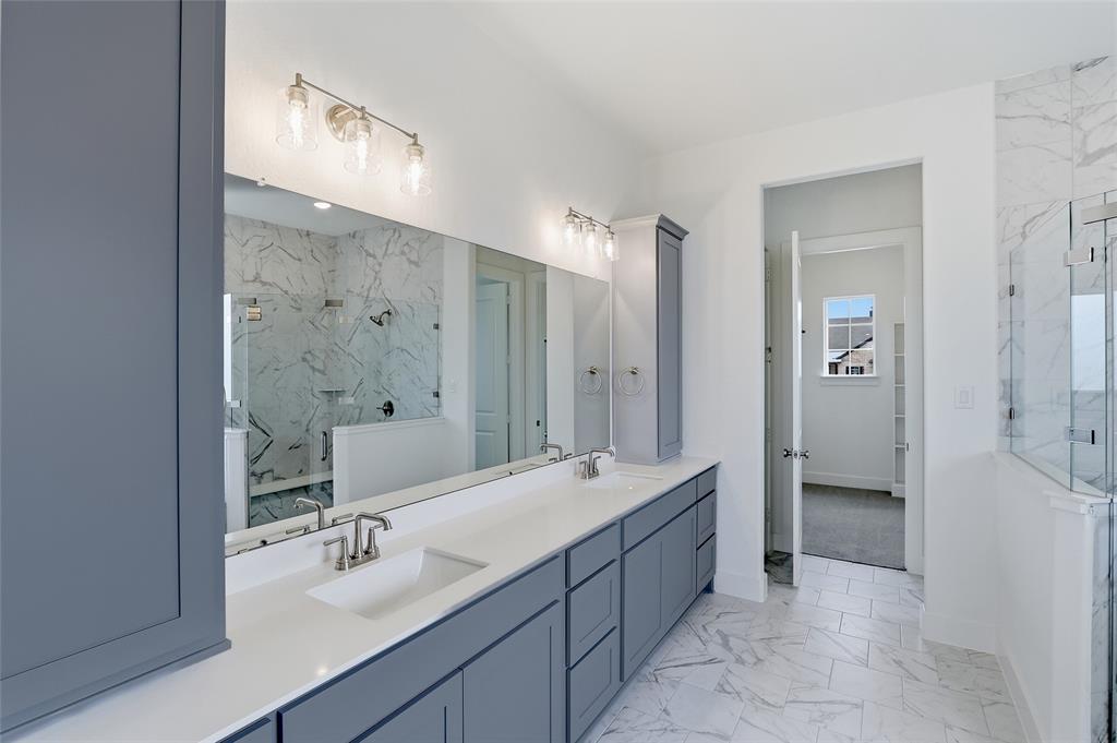 808 Vly Rdg Road Van Alstyne, TX 75495 - Photo 24 of 39 a spacious bathroom with a double vanity sink mirror and shower