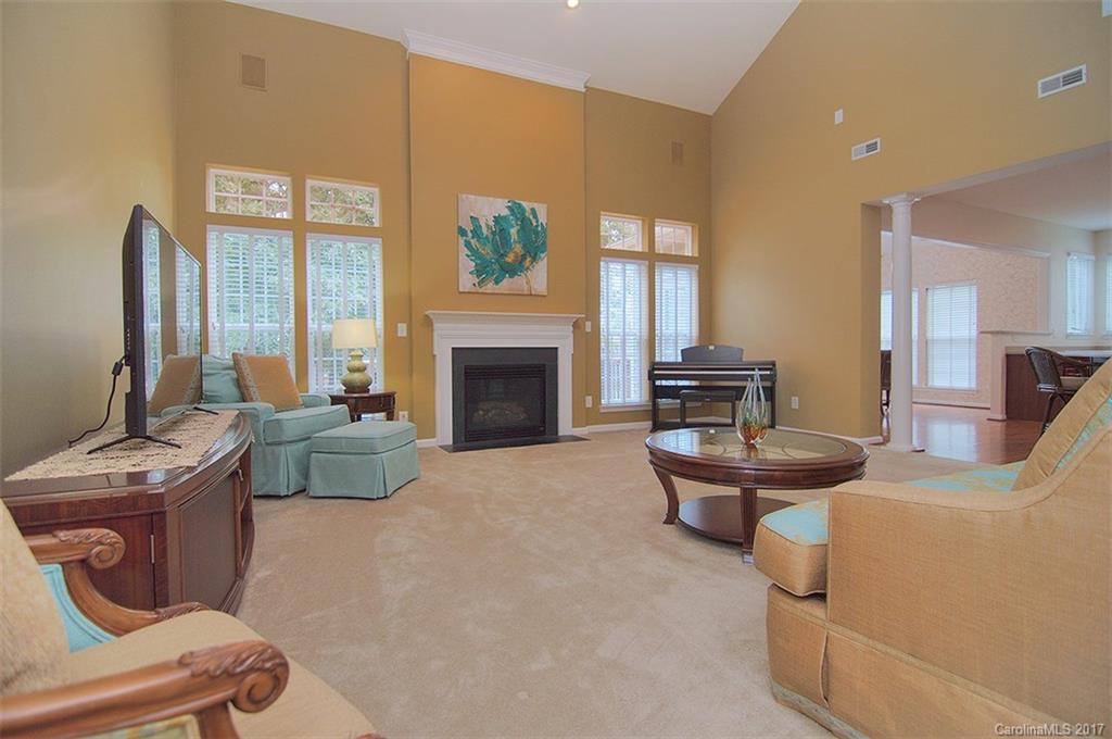 221 Choate Avenue Fort Mill, SC 29708 - Photo 11 of 24 a living room with furniture a fireplace and a flat screen tv