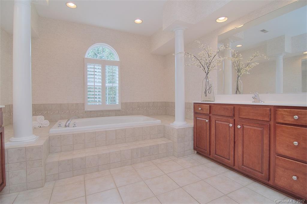 221 Choate Avenue Fort Mill, SC 29708 - Photo 17 of 24 a spacious bathroom with a tub sink and mirror
