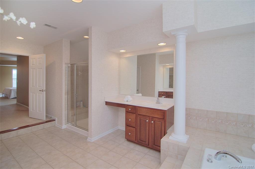 221 Choate Avenue Fort Mill, SC 29708 - Photo 18 of 24 a bathroom with a sink a mirror and a shower