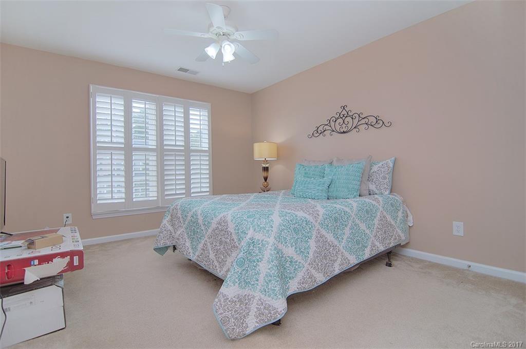 221 Choate Avenue Fort Mill, SC 29708 - Photo 19 of 24 a bed sitting in a bedroom next to a window
