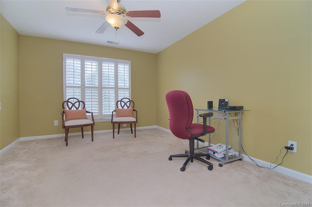 221 Choate Avenue Fort Mill, SC 29708 - Photo 21 of 24 a living room with furniture and a chandelier