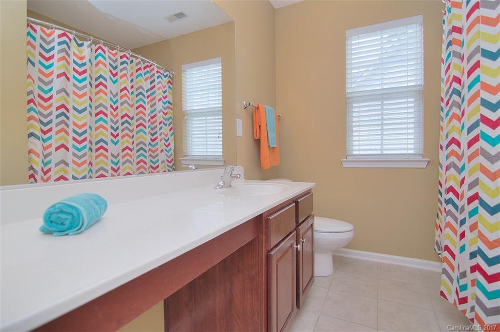 221 Choate Avenue Fort Mill, SC 29708 - Photo 22 of 24 a bathroom with a sink a vanity and a toilet