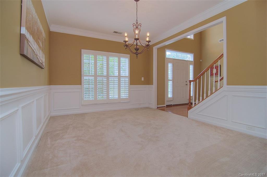 221 Choate Avenue Fort Mill, SC 29708 - Photo 5 of 24 a view of an empty room with chandelier and a window