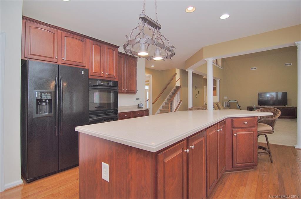 221 Choate Avenue Fort Mill, SC 29708 - Photo 8 of 24 a kitchen with stainless steel appliances granite countertop a refrigerator a sink dishwasher a oven with wooden cabinets and floor