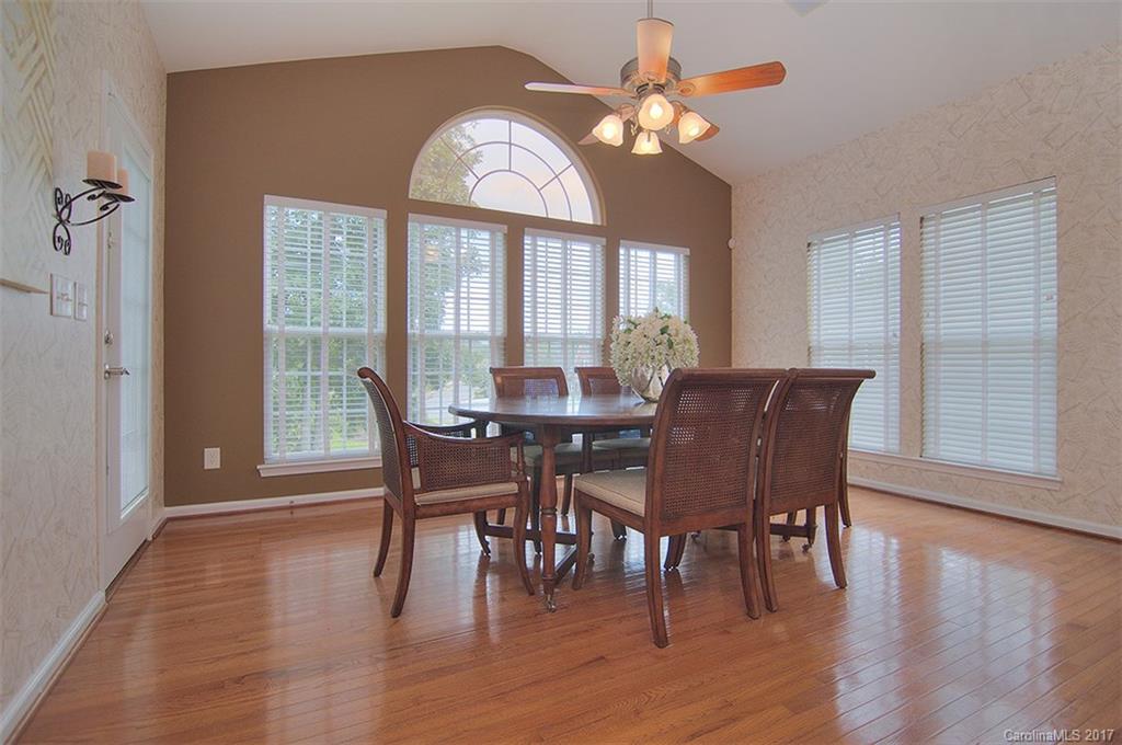 221 Choate Avenue Fort Mill, SC 29708 - Photo 9 of 24 a view of a dining room with furniture window and wooden floor